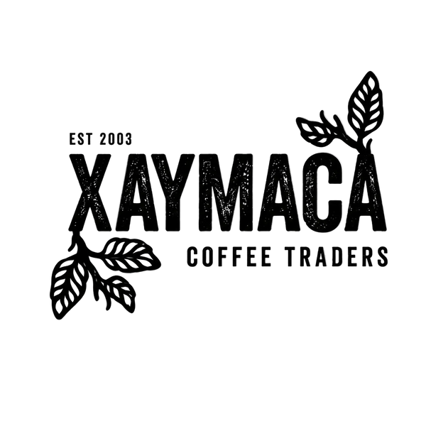 Xaymaca Coffee Traders logo with coffee bean illustrations on a white background